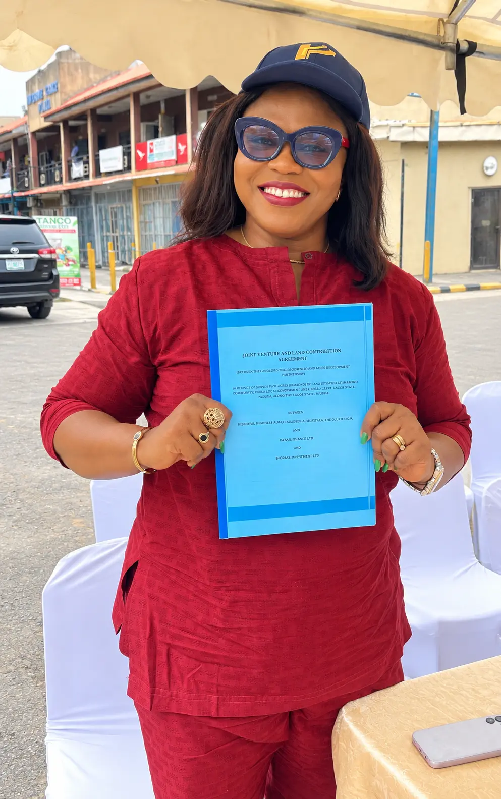 Attendee presenting a bound agreement document